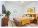 Staged bedroom with warm tones, neutral carpet and abundant light at 456 Harmony Grove Rd, Lilburn, GA 30047