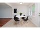 Bright breakfast nook with a round table and four chairs next to a window at 456 Harmony Grove Rd, Lilburn, GA 30047