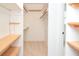 Walk-in closet with built-in shelving and carpet at 456 Harmony Grove Rd, Lilburn, GA 30047
