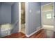 Hallway with wood floors leading to a bathroom and a bedroom at 456 Harmony Grove Rd, Lilburn, GA 30047
