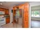Stainless steel refrigerator and wooden cabinets in the kitchen at 456 Harmony Grove Rd, Lilburn, GA 30047