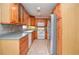 Traditional kitchen with wooden cabinets, tiled backsplash, and stainless steel appliances at 456 Harmony Grove Rd, Lilburn, GA 30047
