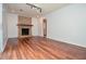 Living room featuring brick fireplace and wood floor at 456 Harmony Grove Rd, Lilburn, GA 30047