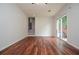 Living room featuring wood floor, stairs, and access to a deck at 456 Harmony Grove Rd, Lilburn, GA 30047