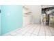 Tiled utility room showing water heater and other utility equipment with pastel blue walls at 456 Harmony Grove Rd, Lilburn, GA 30047
