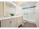 Bathroom featuring a double vanity, ample storage and a glass-enclosed shower with tile surround at 465 Woodbrook Ways, Lawrenceville, GA 30043