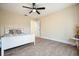 Bedroom showcasing wood floors, a ceiling fan, and a bed with decorative pillows at 465 Woodbrook Ways, Lawrenceville, GA 30043