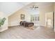 Bedroom showcasing wood floors, windows, a ceiling fan, and modern furnishings at 465 Woodbrook Ways, Lawrenceville, GA 30043