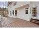 Expansive wooden deck with a white house exterior offers an inviting space for entertaining outdoors at 465 Woodbrook Ways, Lawrenceville, GA 30043