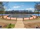 Beautiful water view of a private dock on a lake with well-maintained landscaping at 465 Woodbrook Ways, Lawrenceville, GA 30043