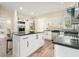Beautiful kitchen featuring granite countertops, white cabinetry, and a stainless steel refrigerator at 465 Woodbrook Ways, Lawrenceville, GA 30043