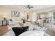 Inviting living room with an open floor plan, comfortable seating, hardwood floors, and natural light at 465 Woodbrook Ways, Lawrenceville, GA 30043