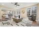 Spacious living room with lots of natural light, an open floor plan, hardwood floors, and neutral decor at 465 Woodbrook Ways, Lawrenceville, GA 30043