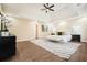 Comfortable main bedroom featuring tray ceilings, hardwood floors, and elegant decor at 465 Woodbrook Ways, Lawrenceville, GA 30043