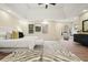 Bright main bedroom with hardwood floors, a ceiling fan, and sitting area at 465 Woodbrook Ways, Lawrenceville, GA 30043