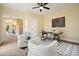 Cozy home office with bright light, stylish furniture, unique decor, and hardwood flooring at 465 Woodbrook Ways, Lawrenceville, GA 30043