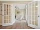 Bright home office with French doors, natural light, modern furnishings, and neutral decor at 465 Woodbrook Ways, Lawrenceville, GA 30043