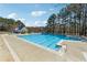 Large community pool with crystal clear water, sunning deck and covered seating areas at 465 Woodbrook Ways, Lawrenceville, GA 30043