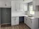 Elegant kitchen featuring sleek white cabinetry, plenty of counter space, and modern appliances at 81 Burbank Nw Dr, Atlanta, GA 30314