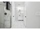 Stylish bathroom featuring a glass-enclosed shower, vanity, and tiled flooring at 912 Ira Sw St, Atlanta, GA 30310