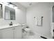 Clean bathroom featuring white marble floors, modern fixtures, and a sleek design for a spa-like experience at 912 Ira Sw St, Atlanta, GA 30310
