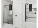 Modern bathroom featuring a glass shower door and tiled walls, blending style and function at 912 Ira Sw St, Atlanta, GA 30310