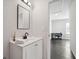 The bathroom includes a modern vanity and mirror, leading to a bedroom/office space at 912 Ira Sw St, Atlanta, GA 30310