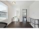 Inviting hallway with natural light, stylish decor, and seamless access to multiple rooms, creating a cohesive flow at 912 Ira Sw St, Atlanta, GA 30310