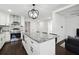 Newly renovated kitchen featuring stainless steel appliances, a spacious island, and modern fixtures at 912 Ira Sw St, Atlanta, GA 30310