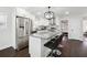Modern kitchen with stainless steel appliances, a granite island, and dark hardwood flooring at 912 Ira Sw St, Atlanta, GA 30310