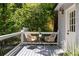 Charming back porch with outdoor seating, a tranquil retreat amidst the surrounding greenery at 1195 Cameron Ct, Atlanta, GA 30306