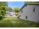An immaculate backyard with green lawn and an elevated deck provides space for entertaining at 1195 Cameron Ct, Atlanta, GA 30306