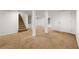 Spacious basement featuring carpet flooring, support pillars, and access to the staircase at 1195 Cameron Ct, Atlanta, GA 30306