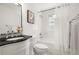 Classic bathroom with white subway tile, black vanity, and a shower/tub combo with bright natural light at 1195 Cameron Ct, Atlanta, GA 30306