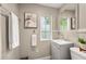 Cozy bathroom featuring neutral tones, a charming window, and ample storage at 1195 Cameron Ct, Atlanta, GA 30306