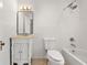 Well-lit bathroom with a classic vanity, tiled shower, and bathtub, offering a clean and functional space at 1195 Cameron Ct, Atlanta, GA 30306