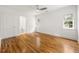Bright bedroom with hardwood floors, a ceiling fan, and natural light streaming through the windows at 1195 Cameron Ct, Atlanta, GA 30306