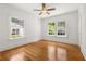 Bright, empty bedroom with hardwood floors and natural light streaming through large windows, ready for personalization at 1195 Cameron Ct, Atlanta, GA 30306