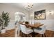 Elegant dining room featuring hardwood floors, and modern lighting at 1195 Cameron Ct, Atlanta, GA 30306