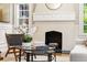 Close-up of fireplace, modern furniture, and arched windows at 1195 Cameron Ct, Atlanta, GA 30306