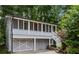 Garage with a full screened-in porch above is located on the side of the house at 1195 Cameron Ct, Atlanta, GA 30306