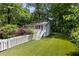Charming guest house with white picket fence and lush green lawn at 1195 Cameron Ct, Atlanta, GA 30306