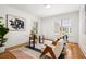 Bright home office with modern decor, hardwood floors, and ample natural light through large windows at 1195 Cameron Ct, Atlanta, GA 30306