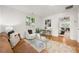 Bright living room with hardwood floors, comfortable seating, and views to the bedroom at 1195 Cameron Ct, Atlanta, GA 30306