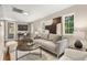 Comfortable living room with natural light, stylish decor, and hardwood floors at 1195 Cameron Ct, Atlanta, GA 30306