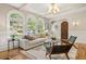 Bright living room with hardwood floors, arched windows, and modern furniture at 1195 Cameron Ct, Atlanta, GA 30306