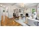 Open concept living room with fireplace, hardwood floors, and modern furniture at 1195 Cameron Ct, Atlanta, GA 30306
