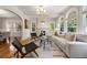 Bright living room with hardwood floors, fireplace, modern furniture, and arched windows at 1195 Cameron Ct, Atlanta, GA 30306