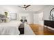 Spacious main bedroom boasts hardwood floors, a ceiling fan, and a decorative rug at 1195 Cameron Ct, Atlanta, GA 30306