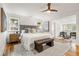 Spacious main bedroom with hardwood floors, a ceiling fan, and a comfortable seating area at 1195 Cameron Ct, Atlanta, GA 30306
